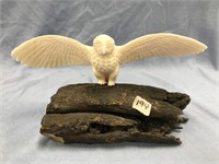 Ivory owl 8" wingspan mounted on black fossilized