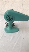 Vintage turquoise dominion blow dryer on stand