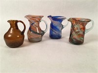 Four Small Art Glass Pitchers