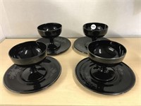 4 Sets Of Black Cups And Plates