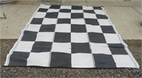 Large outdoor camping carpet measures 9' X 11'.