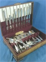 Mismatched set of silverware in wooden case