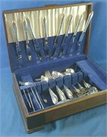 Mismatched set of silverware in wooden case