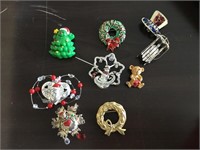(9) Christmas brooches