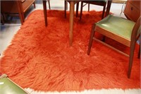 Vibrant burnt orange/red flokati style rug,