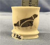 Ivory cup scrimshawed with striped seal and swimmi