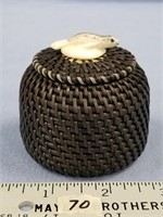 Baleen basket with seal finial scrimshawed with in