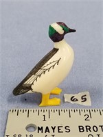 2" Ted Mayac carved ivory bird with a green and pu