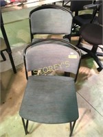 Stack chairs, green fabric on black meatl frame
