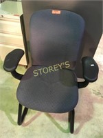 Sled base guest chair with arm on black frame