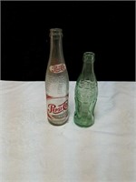 Dueling pair of vintage soda bottles Pepsi bottle