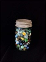 Perfect mason blue ball jar full of marbles