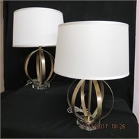Pair of metal sphere lamps on glass bases