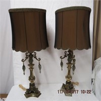 Pair of ornate metal table lamps with smoked
