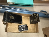 Projector screen and vintage cameras