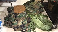 Military duffel bag with a poncho, coat liner,