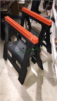 Pair of folding plastic sawhorses, 31 inches tall