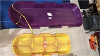 Two molded plastic snow sleds with Pull ropes, 48