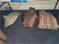 Lot Of Hooked Rugs Located Under Table