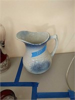 Blue sponge Ware pitcher with small crack