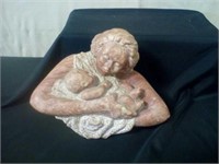 Stone mother and child sculpture