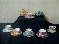 Decorative tea cups and plates with napkin holder