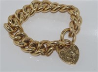 Good 9ct yellow gold bracelet with heart clasp