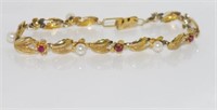 Gold, ruby and pearl bracelet marked 14K