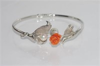 Silver bangle decorated with carved coral flowers
