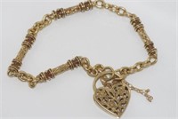 Good 9ct yellow gold bracelet with heart lock