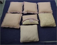 Seven assorted cushions