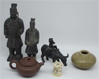 Two Chinese immortal figures, a Yixing teapot