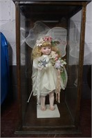Angel Doll Inside Enclosure