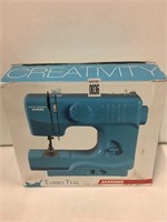 JANOME TURBO TEAL SEWING MACHINE COLOR BLUE