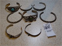 8 Southwestern cuff bracelets.
