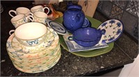 Group of pottery dinnerware, coffee pot, console