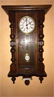 Antique wall clock with the pendulum marked R A,