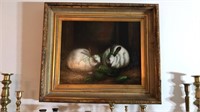 Framed oil on canvas of two bunny rabbits, signed