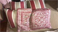 Four designer pillows and one extra pillow cover