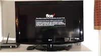 LG 32 inch flatscreen TV with the remote, model