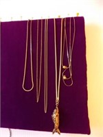 Five gold tone necklaces