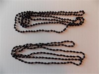 Two 64" black glass bead, knotted, necklaces,