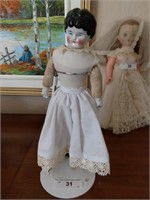 Antique doll with porcelain head hands and legs
