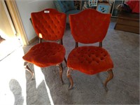 Two vintage orange parlor chairs