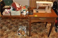 SINGER SEWING MACHINE IN CABINET AND SUPPLIES