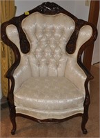 HEAVILY CARVED WING BACK CHAIR