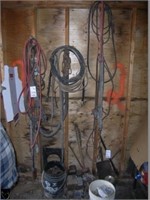 Partial wall w/ electrical cable, hose, haims