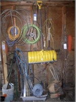 Partial wall w/ lariet, extension cords, shovels