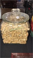 Planters peanut jar full of peanuts with the lid