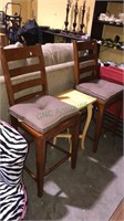 Two wooden bars chairs & a center table plus